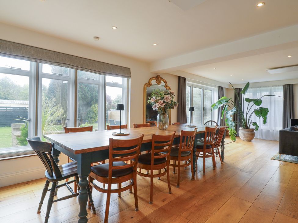 A dining room with a table and chairs at Denmark House in Chatham, Kent