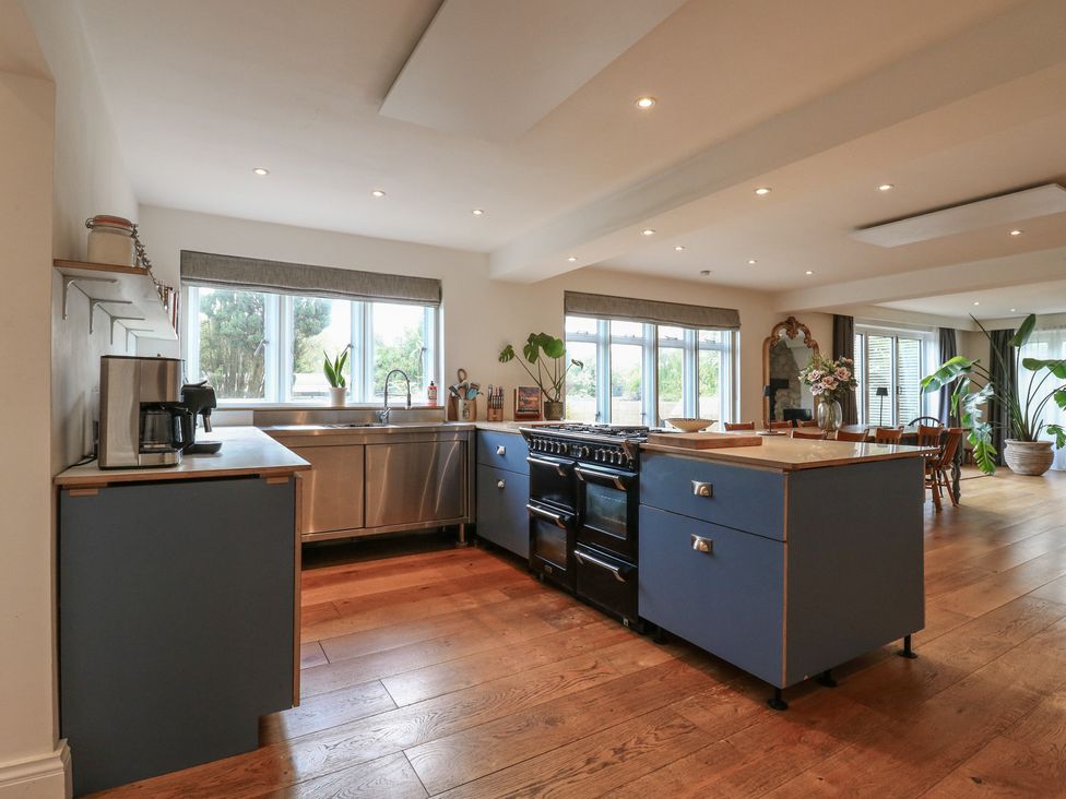 A kitchen with a stove and sink at Denmark House in Chatham, Kent