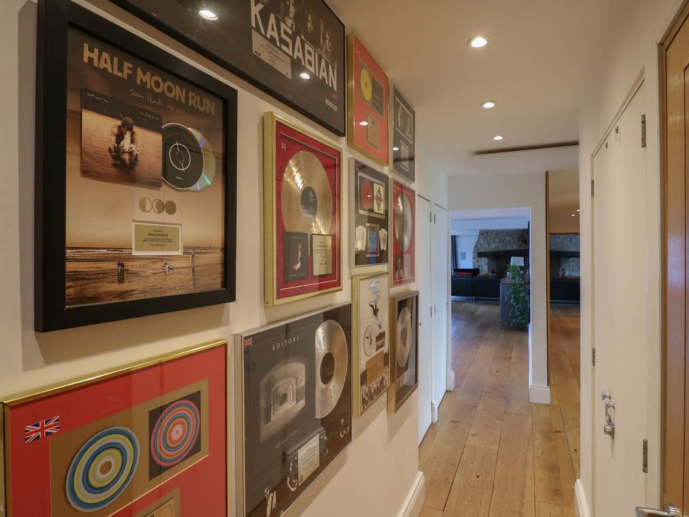 A hallway with framed music awards at Denmark House in Chatham, Kent