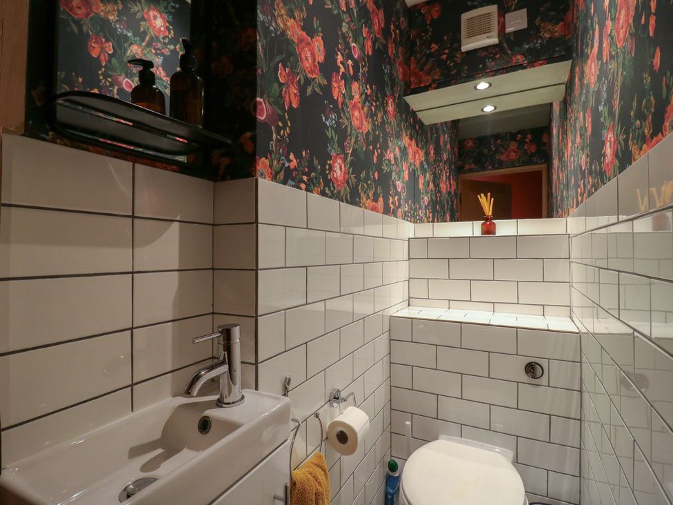 A bathroom with a sink and toilet at Denmark House in Chatham, Kent