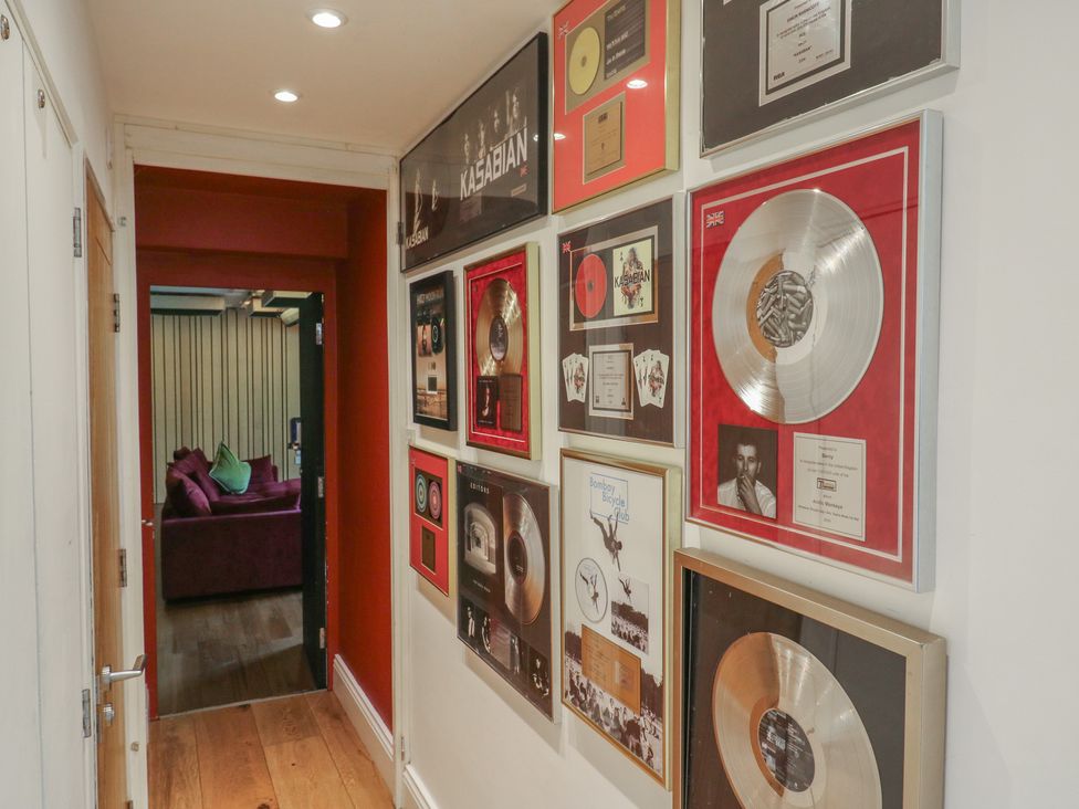 A hallway with music awards on the wall at Denmark House in Chatham, Kent