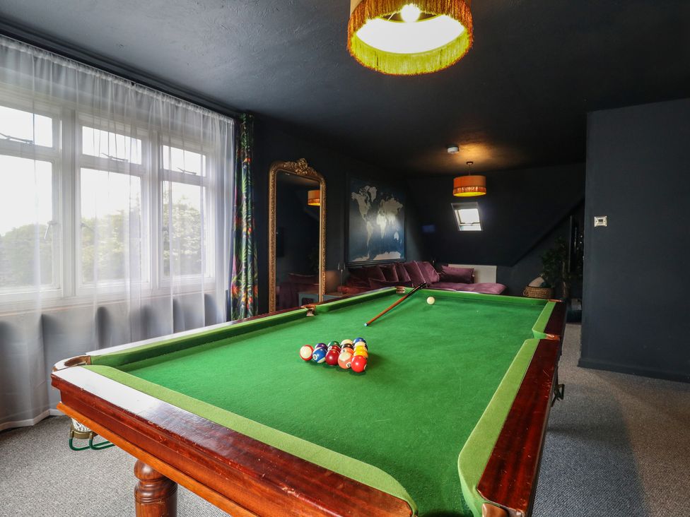 A recreation room with a pool table and a sofa at Denmark House in Chatham, Kent
