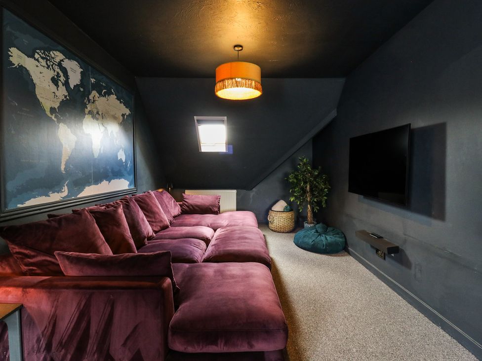 A snug with a sofa and wall map at Denmark House in Chatham, Kent