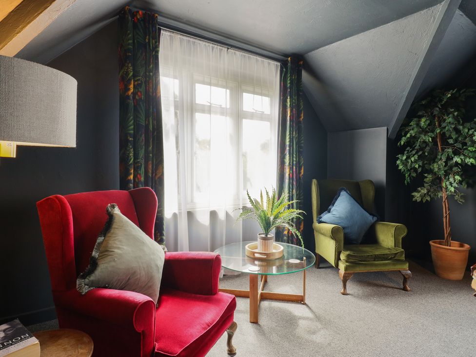 A sitting room with two chairs and a coffee table at Denmark House Chatham, Kent