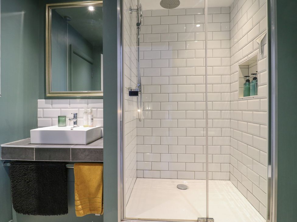 A bathroom with a sink and shower at Denmark House in Chatham, Kent