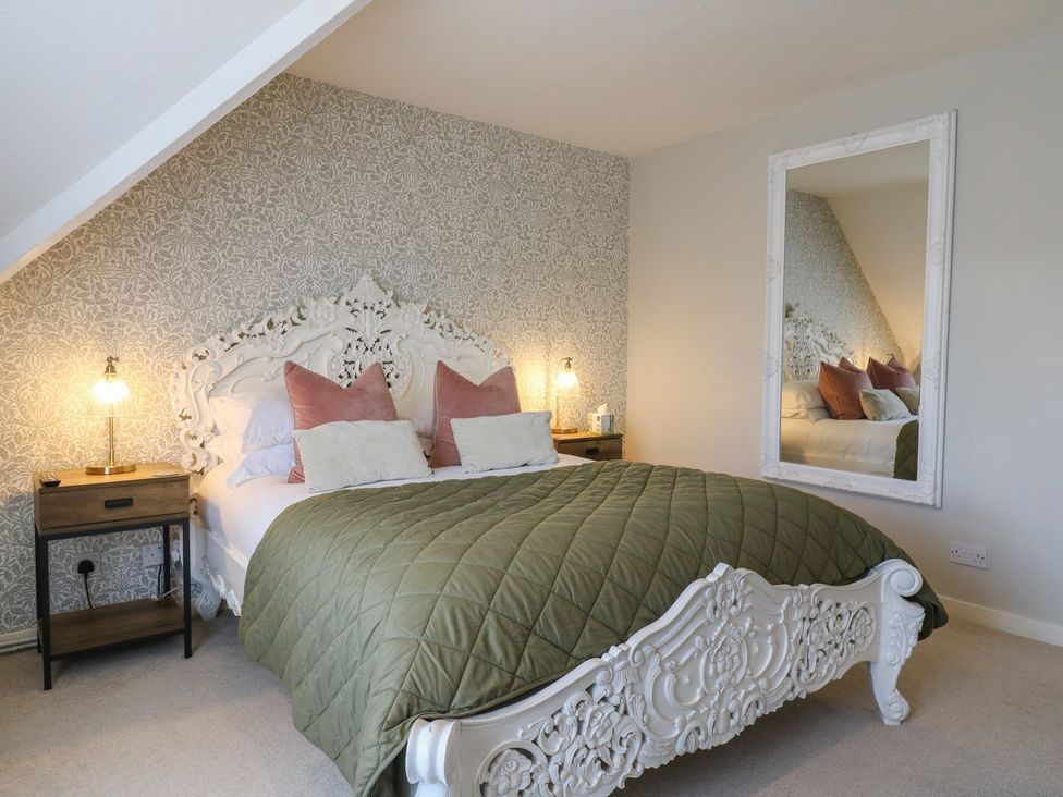A bedroom with a bed and nightstand at Denmark House in Chatham, Kent