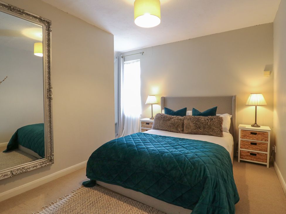 A bedroom with a bed and nightstands at Denmark House in Chatham, Kent