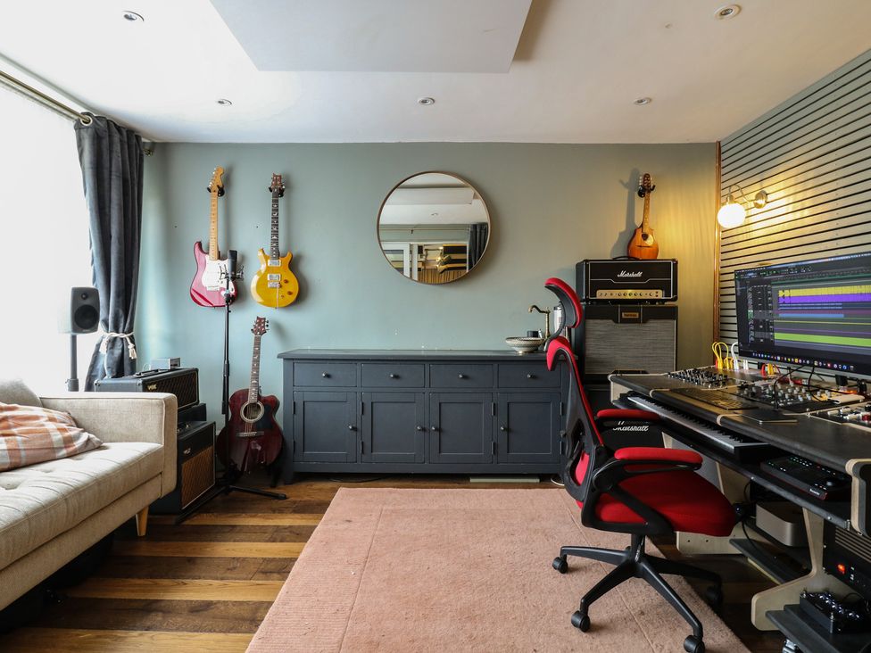 A music studio with guitars and equipment at Denmark House, Chatham, Kent