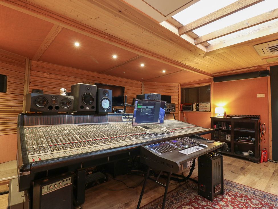 A music studio with a mixing console and computer at Denmark House, Chatham, Kent