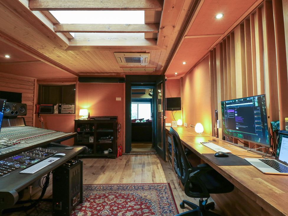 A studio with a mixing console and computers at Denmark House in Chatham, Kent