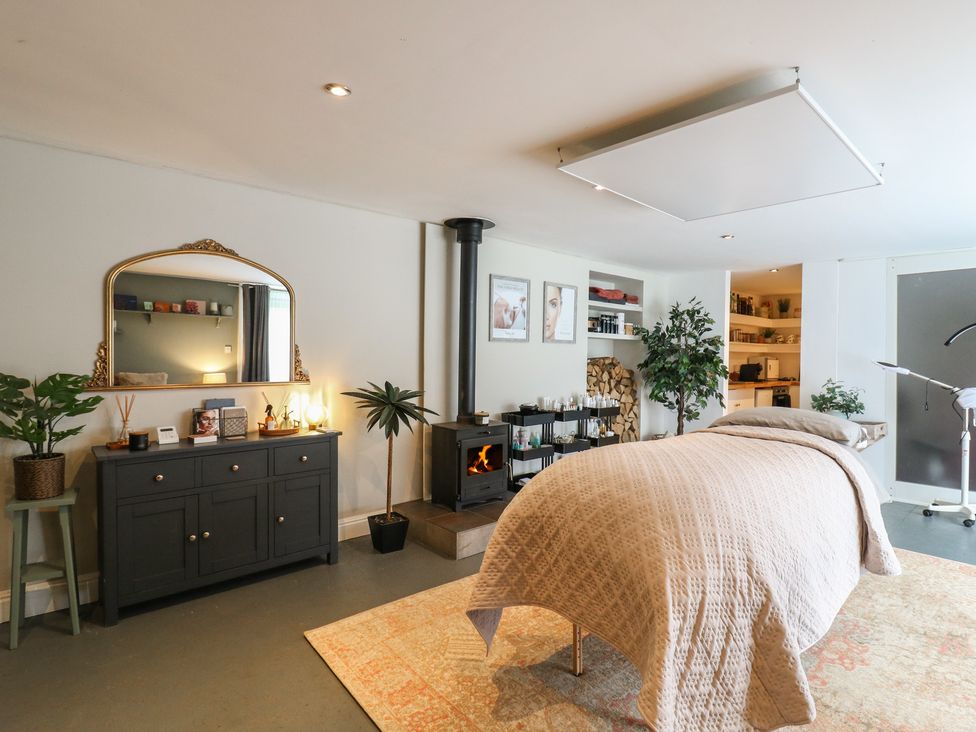 A bedroom with a bed and plants at Denmark House in Chatham, Kent