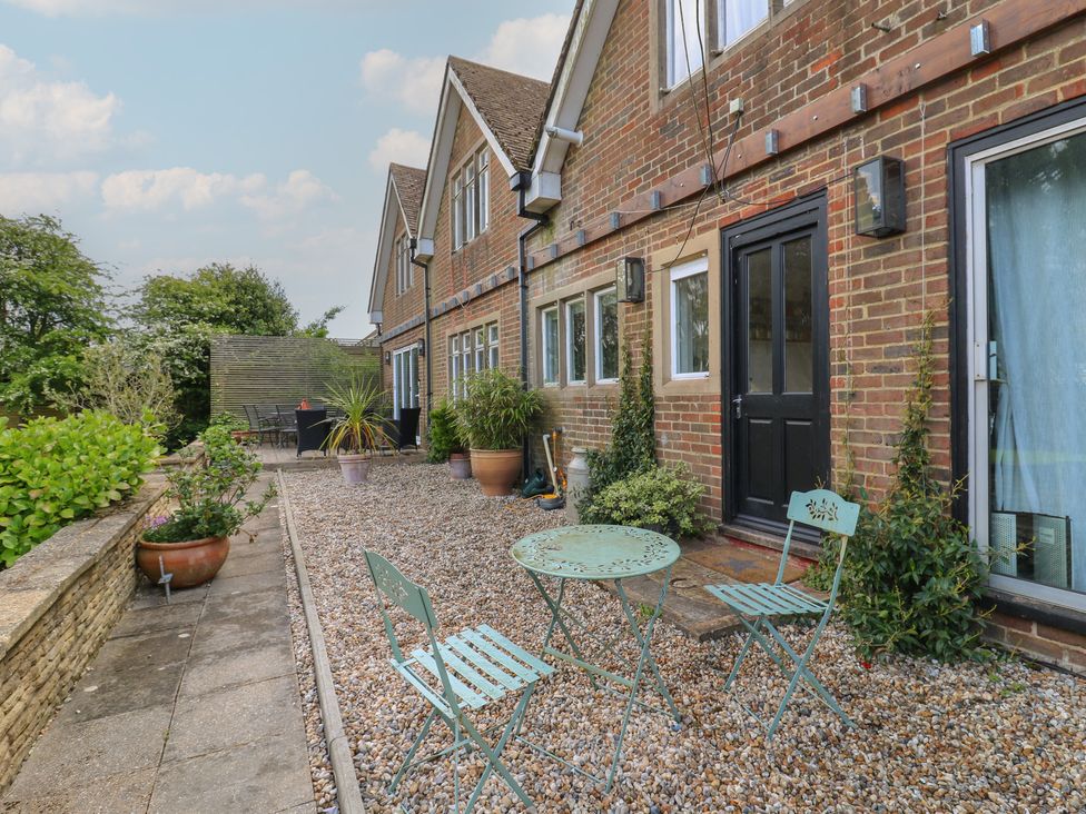 A garden with chairs and a table at Denmark House, Chatham, Kent