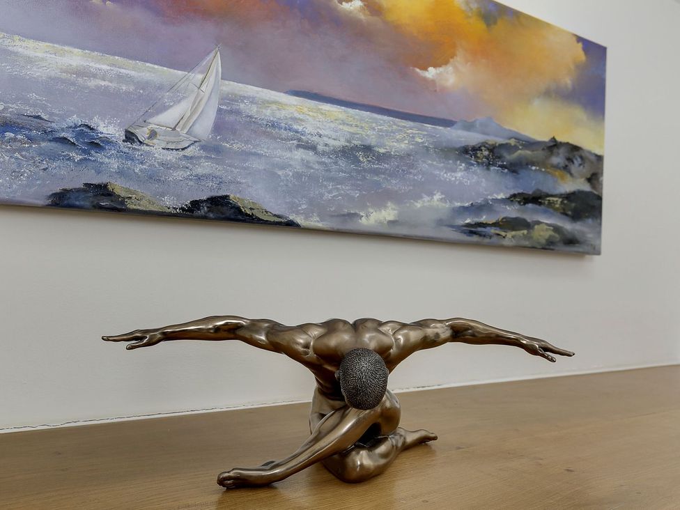 A sculpture and painting in a gallery at Poppyfields Stable Redruth