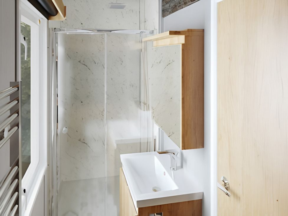A bathroom with a shower and a sink at Inverness Lodge in Inverness