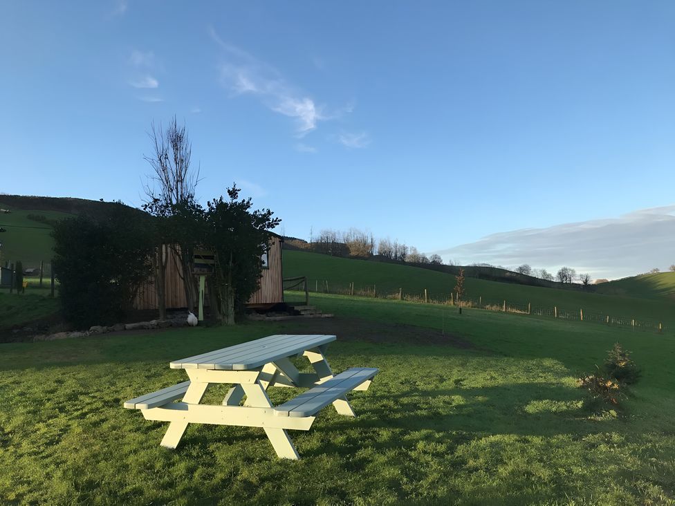 A picnic table on grass at Shepherds hut Dumfries