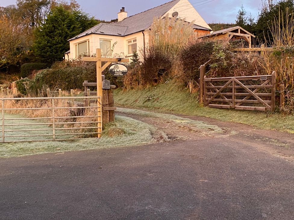 A house with a gate and sign at Shepherds hut in Dumfries