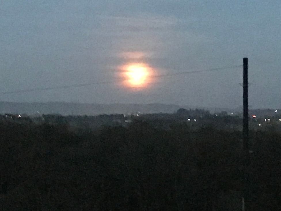 A landscape with the moon in the sky at Shepherds hut in Dumfries