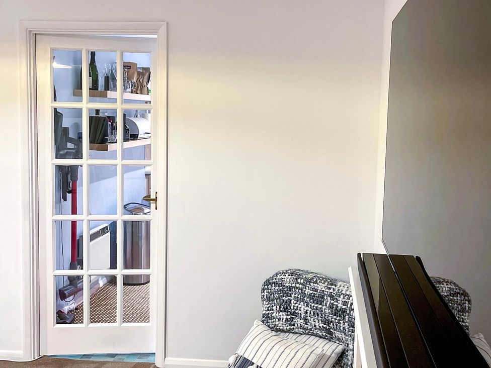 A kitchen with a glass door and shelves visible at 1-Bed Apt in Rochester, Kent