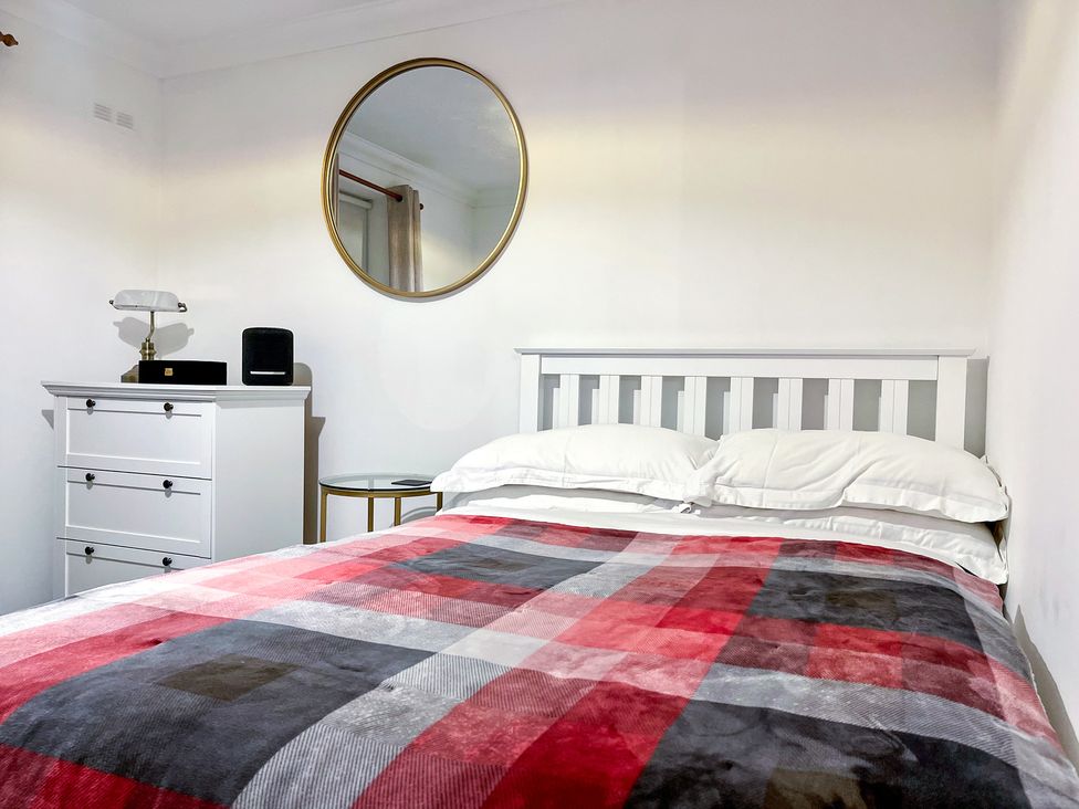 A bedroom with a bed and dresser at 1-Bed Apt in Rochester, Kent
