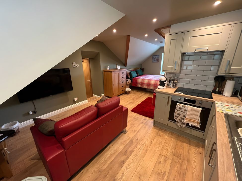 A studio with kitchen and sleeping area at 1 Bed Studio in Pitlochry
