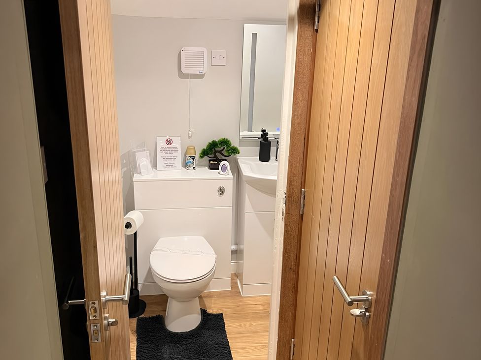 A bathroom with a toilet and sink at 1 Bed Studio in Pitlochry