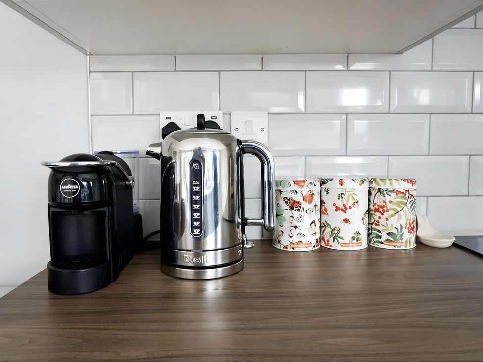 A kitchen with a kettle and coffee machine at Love Lane Villa, Lincoln