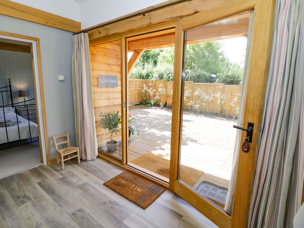 A view from indoors showing a door and outdoor area at Goose Lodge in Shipston-on-Stour
