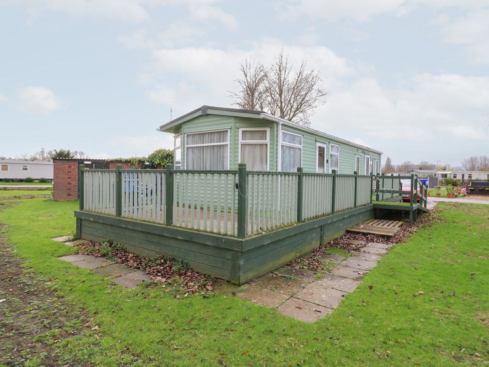 A mobile home with a deck and steps at No 35 MP Billing Aquadrome Holiday Park