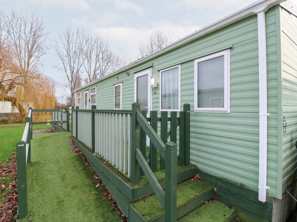 A mobile home with stairs and a pathway at No 35 MP Billing Aquadrome Holiday Park in 