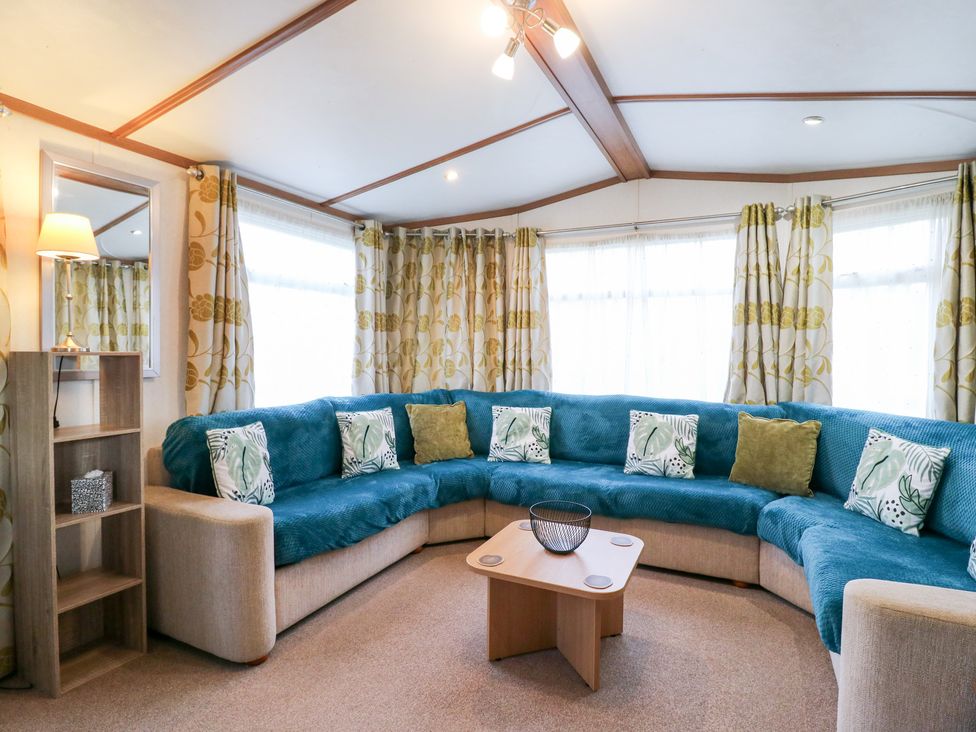 A living room with a sectional sofa and a coffee table at No 35 MP Billing Aquadrome Holiday Park