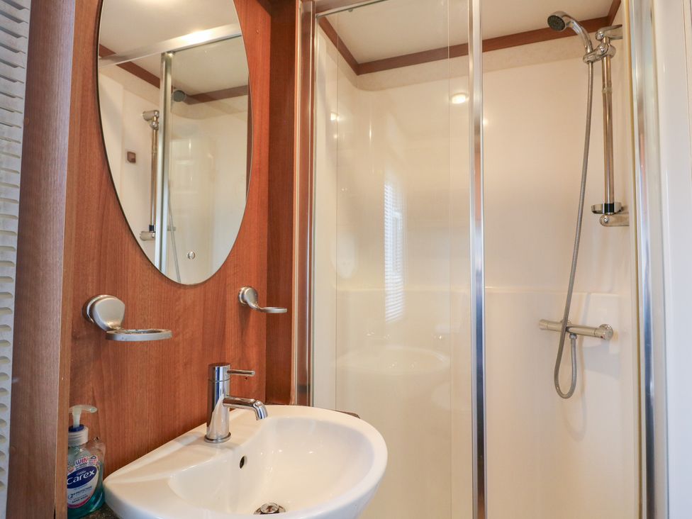 A bathroom with a sink and shower at No 35 MP Billing Aquadrome Holiday Park