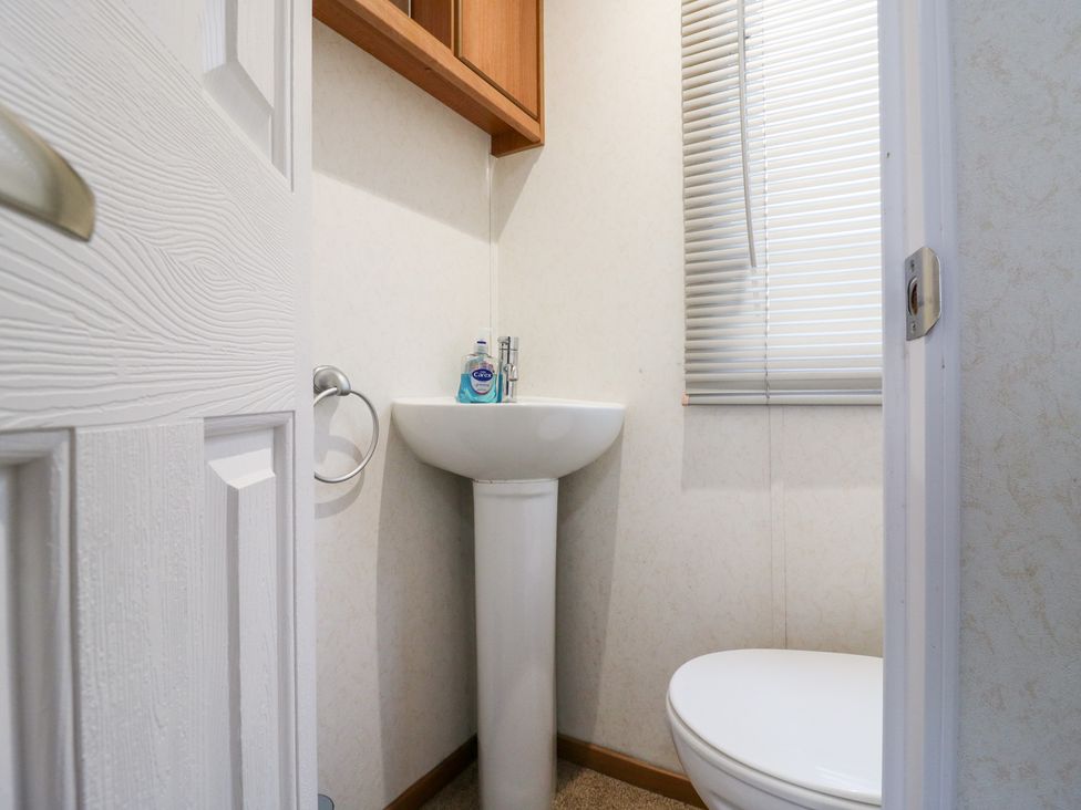 A bathroom with a sink and toilet at No 35 MP Billing Aquadrome Holiday Park