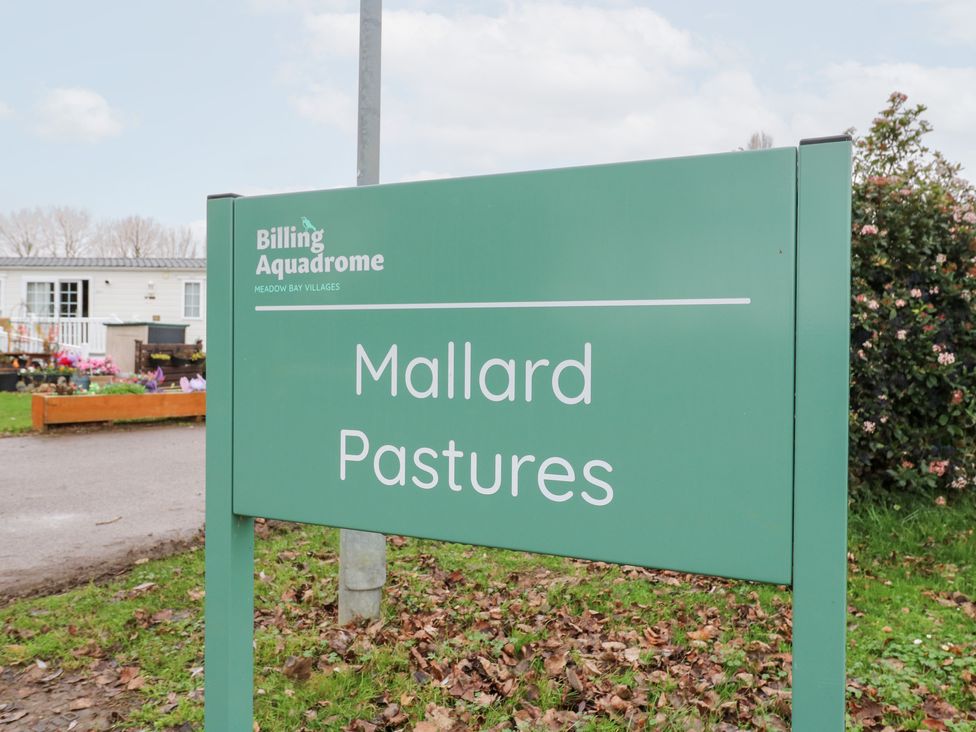 A sign for Mallard Pastures at Billing Aquadrome Holiday Park