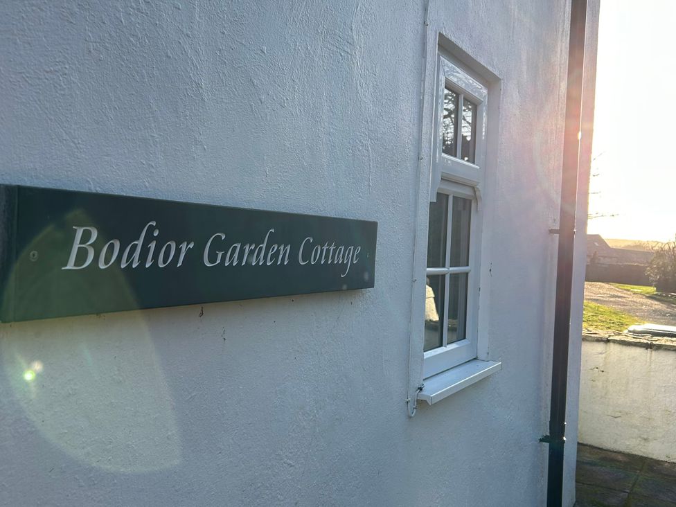 A sign for Bodior Garden Cottage at Bodior Garden Cottage Bach Rhoscolyn