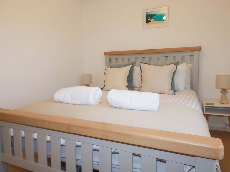 A bedroom with a bed and pillows at Poldreth in Truro