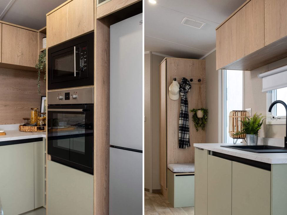 A kitchen with modern appliances and cabinets at Arlington 40 x 14 Three Bed in Northwich