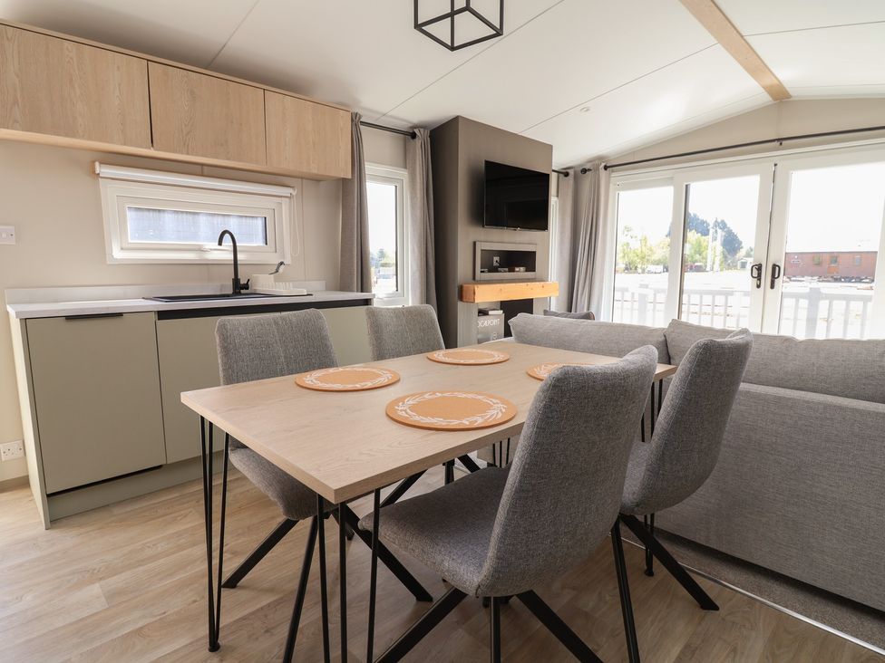 A dining area with a table and chairs at No.6 - The Pines in Delamere