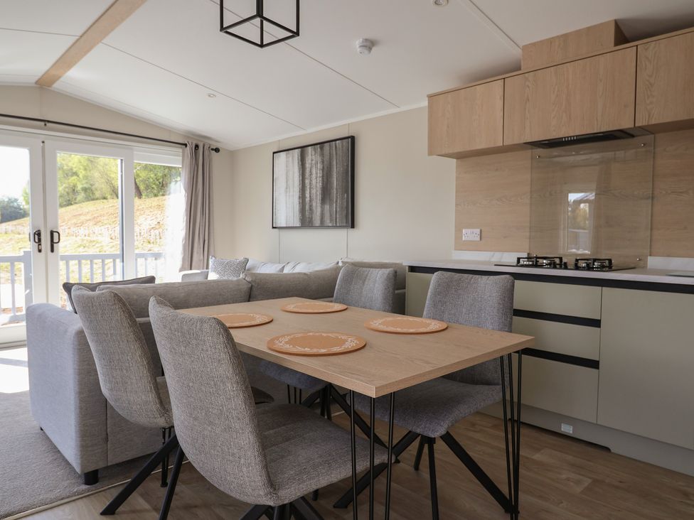A dining room with a table and chairs at No.6 - The Pines, Delamere