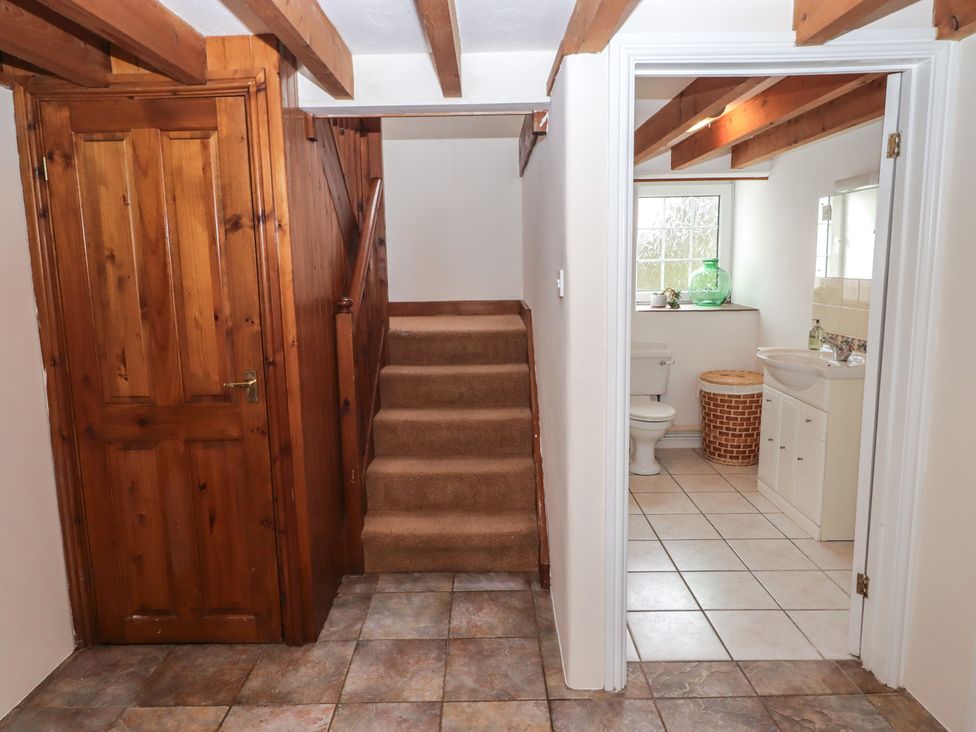 An entrance area with stairs and bathroom features at Rhosgranog Cottage Llandeloy near Solva