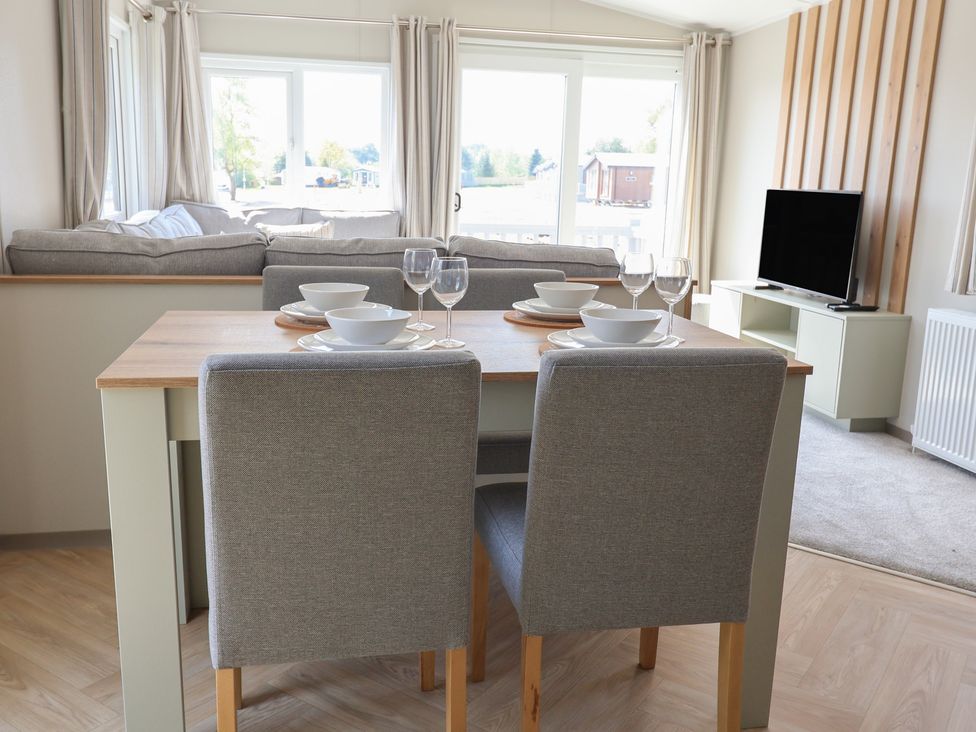 A dining area with a table and chairs at No.20 - The Oaks Delamere
