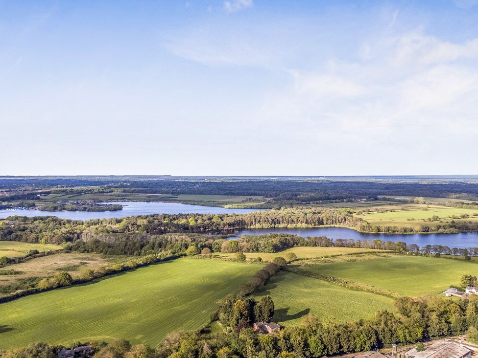 An aerial view of fields and lakes at The Oaks 2 Bedrooms Delamere