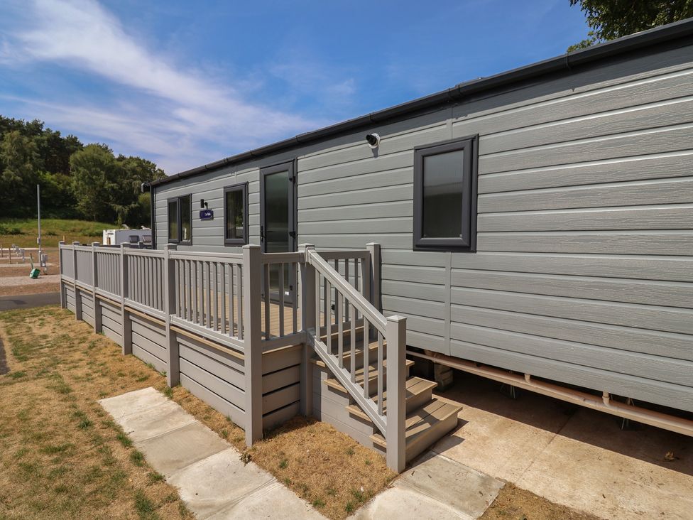 A house with steps and railing at The Oaks 2 Bedrooms Delamere