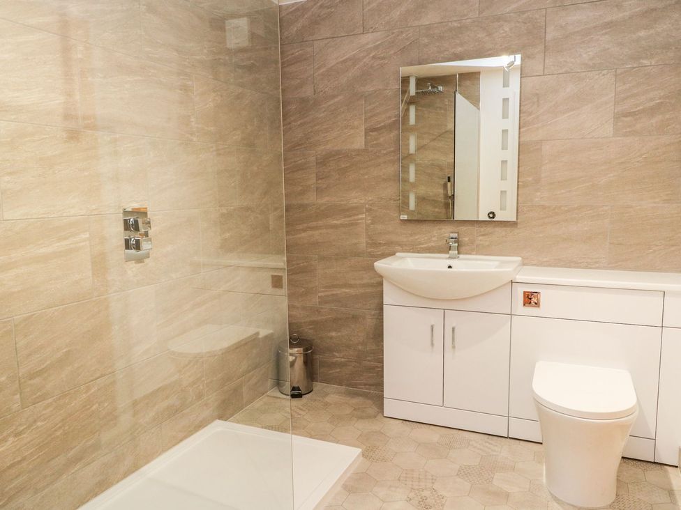 A bathroom with sink and shower enclosure at Flour Loft in Anstruther