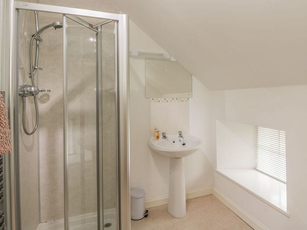 A bathroom with shower and sink at Flour Loft in Anstruther