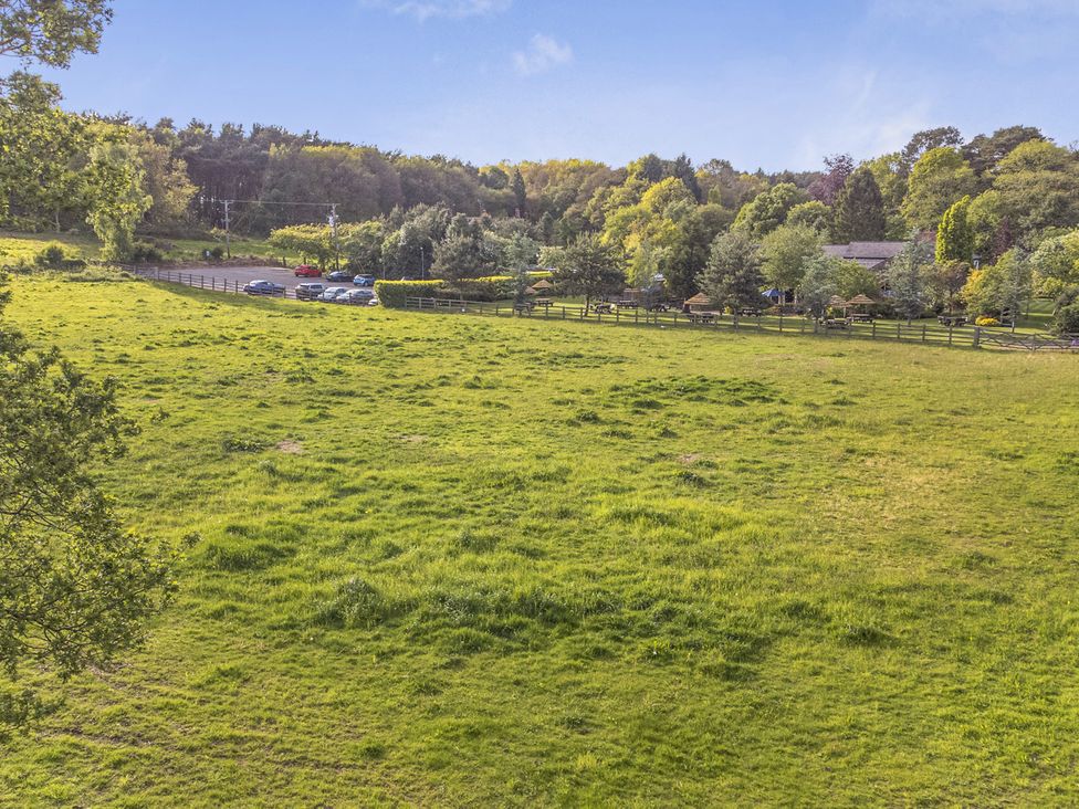 An open field with cars parked along the edge at Cedar Lodge 2 Bedrooms with hot tub Delamere