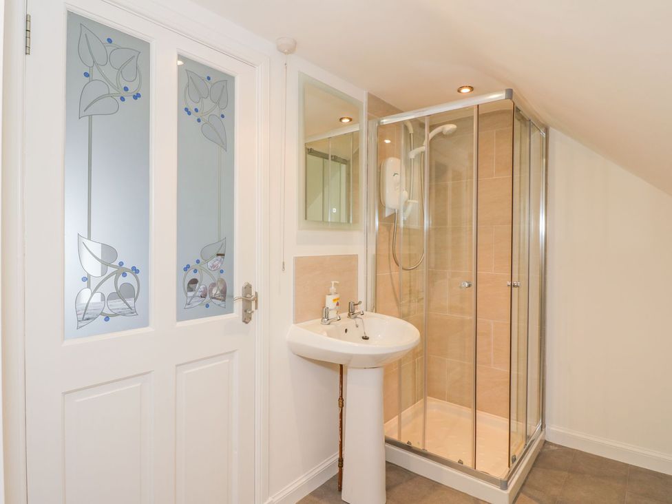 A bathroom with a sink and shower at Maimie’s Harbourview Anstruther