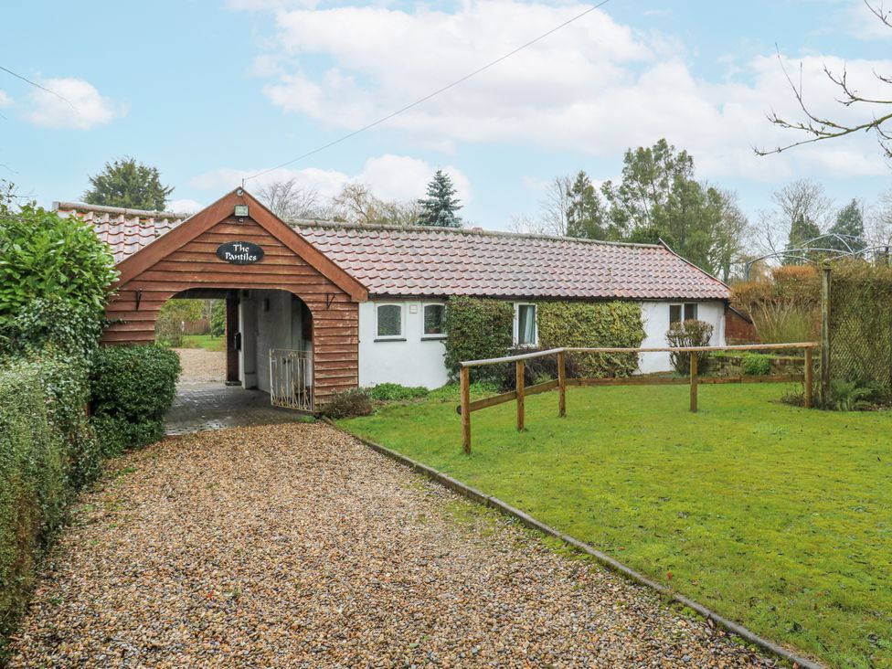 A house with a pathway and garden at The Pantiles in Banham