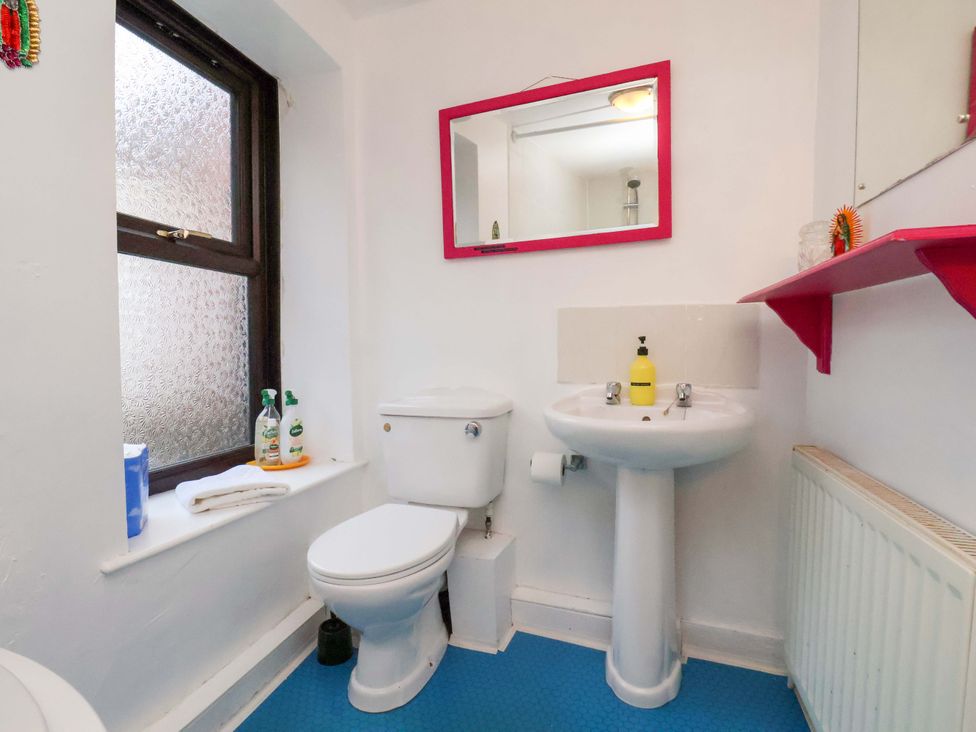 A bathroom with a sink and toilet at Frida's Cottage in Whitby