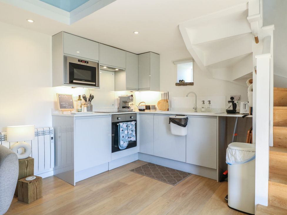 A kitchen with appliances and cabinets at Little Barn in Grindon
