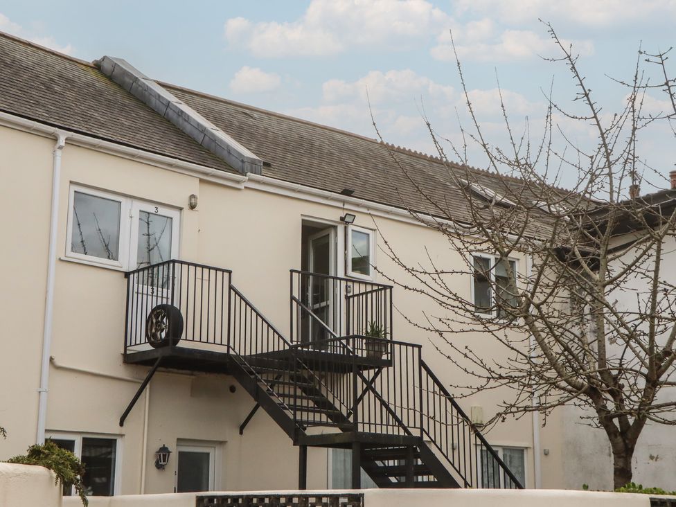 An outdoor view of a building with stairs and windows at Petitor Mews